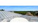 A rooftop deck features comfortable seating with treetop and neighborhood views at 630 Companion Way, Longboat Key, FL 34228