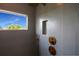 Modern shower with sleek grey tile, gold hardware, and natural light from the window at 630 Companion Way, Longboat Key, FL 34228