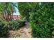 Scenic community walkway amidst lush greenery at 630 Companion Way, Longboat Key, FL 34228