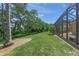 Well maintained backyard with green grass and shade covering at 790 Shadow Bay Way, Osprey, FL 34229