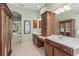 Bathroom featuring dual sinks, vanity, decorative lighting, and decorative mirror at 790 Shadow Bay Way, Osprey, FL 34229