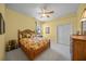 Comfortable bedroom with yellow walls, plush bedding, and ample closet space at 790 Shadow Bay Way, Osprey, FL 34229