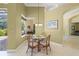Dining area with seating for four and views to the screened lanai at 790 Shadow Bay Way, Osprey, FL 34229