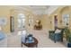 Open floorplan with foyer, dining area, and living room with elegant chandelier at 790 Shadow Bay Way, Osprey, FL 34229