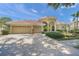 Charming single-story home featuring a well-manicured lawn and a spacious three car garage at 790 Shadow Bay Way, Osprey, FL 34229
