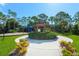 A well-maintained community gazebo with vibrant landscaping is perfect for gatherings at 790 Shadow Bay Way, Osprey, FL 34229