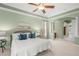 Relaxing main bedroom with natural light, comfortable bedding and access to the ensuite bathroom at 790 Shadow Bay Way, Osprey, FL 34229