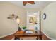 Cozy office with desk, hardwood floors, and an open doorway at 790 Shadow Bay Way, Osprey, FL 34229