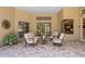 Covered patio with outdoor furniture, neutral tones, and ample natural light at 790 Shadow Bay Way, Osprey, FL 34229