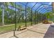 Spacious screened-in patio with a brick-paved floor, offering outdoor relaxation space at 790 Shadow Bay Way, Osprey, FL 34229