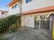The backyard features a concrete patio area, privacy fence, and sliding glass door entrance to the home at 1655 58Th S Ter # 7, St Petersburg, FL 33712