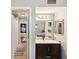 This bathroom has a single vanity with decorative mirror and lighting, and a shower/tub combo in the background at 1655 58Th S Ter # 7, St Petersburg, FL 33712