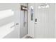 Bright entryway with a modern white door, a smart lock, and convenient key storage at 1655 58Th S Ter # 7, St Petersburg, FL 33712