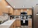 Updated kitchen featuring stainless steel appliances, wood cabinets, and recessed lighting at 1655 58Th S Ter # 7, St Petersburg, FL 33712