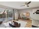 Modern living room featuring wood floors, sliding glass doors to backyard, and updated decor at 1655 58Th S Ter # 7, St Petersburg, FL 33712
