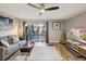 Cozy living room with modern decor, hardwood floors, and sliding glass doors to the backyard at 1655 58Th S Ter # 7, St Petersburg, FL 33712
