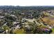 Aerial view of neighborhood showcasing the property's location, mature trees, and surrounding community at 1717 32Nd St, Sarasota, FL 34234