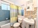Traditional bathroom featuring a tiled shower and tub, and a pedestal sink at 2075 Canal Dr # L36, Bradenton, FL 34207