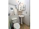Traditional bathroom featuring wainscotting and pedestal sink and neutral decor at 2075 Canal Dr # L36, Bradenton, FL 34207