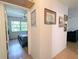Hallway view to bedroom with natural light and ceiling fan and hardwood flooring at 2075 Canal Dr # L36, Bradenton, FL 34207