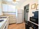 Bright kitchen featuring classic appliances, ample counter space, and natural light from a window at 2075 Canal Dr # L36, Bradenton, FL 34207