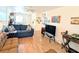 Bright living room featuring a sofa, wood laminate floors, and contemporary decorations at 2075 Canal Dr # L36, Bradenton, FL 34207