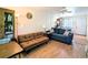 Cozy living room features two sofas, hardwood floors, and plenty of natural light at 2075 Canal Dr # L36, Bradenton, FL 34207