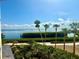 Expansive water view with palm trees, lush landscaping and blue skies at 2110 Harbourside Dr # 526, Longboat Key, FL 34228