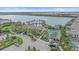 Lakefront community with pool, tennis courts, clubhouse, and parking for residents and guests at 328 Aria Dr, Nokomis, FL 34275