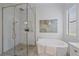 Bright bathroom featuring a glass-enclosed shower and a freestanding tub with modern fixtures at 328 Aria Dr, Nokomis, FL 34275