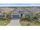 Beautiful home with lush landscaping and a paver driveway at 328 Aria Dr, Nokomis, FL 34275