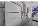 Tesla Powerwall in garage with electrical panel and car charger at 328 Aria Dr, Nokomis, FL 34275