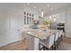 Spacious kitchen with island seating, stainless appliances, and plenty of storage at 328 Aria Dr, Nokomis, FL 34275