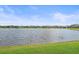 Scenic lake view in a serene community setting at 328 Aria Dr, Nokomis, FL 34275