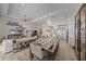 Open-concept living and dining area with modern décor and ample natural light at 328 Aria Dr, Nokomis, FL 34275