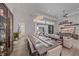 Bright open-concept living and dining area with hardwood floors at 328 Aria Dr, Nokomis, FL 34275