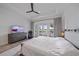 Spacious main bedroom featuring tray ceiling, ceiling fan, and access to the outdoor patio at 328 Aria Dr, Nokomis, FL 34275