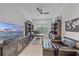 Comfortable home office with custom built-ins, plantation shutters, and a ceiling fan at 328 Aria Dr, Nokomis, FL 34275
