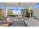 An outdoor patio with comfortable seating and a view of the lake at 328 Aria Dr, Nokomis, FL 34275