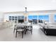 Bright dining area with city and ocean views and ample seating for sophisticated dining and entertaining at 6100 Midnight Pass Rd # 401, Sarasota, FL 34242