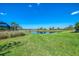 A view of the pond from the backyard of the property at 6284 Talon Preserve Dr, Nokomis, FL 34275