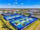 Aerial image showcasing the community's tennis and pickleball courts, offering residents a range of recreational activities at 6284 Talon Preserve Dr, Nokomis, FL 34275