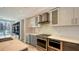 Close up of a well-lit modern kitchen featuring quartz countertops and backsplash and stainless steel appliances at 111 S Pineapple Ave # 708, Sarasota, FL 34236