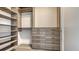 Organized walk-in closet with built-in shelves and drawers providing ample storage at 111 S Pineapple Ave # 708, Sarasota, FL 34236