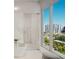 Bright bathroom with walk-in shower, modern fixtures, and a stunning waterfront view at 223 Golden Gate Point # 2A, Sarasota, FL 34236
