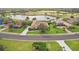 Aerial view of a lovely single-Gathering home, golf course, and water feature in a desirable community at 2611 Little Country Rd, Parrish, FL 34219
