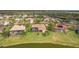 Aerial view of homes with swimming pools and views of a beautiful lake at 2611 Little Country Rd, Parrish, FL 34219