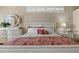Bedroom showcasing a white four-poster bed with decorative bedding and elegant white dresser at 2611 Little Country Rd, Parrish, FL 34219