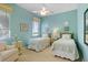 Light and airy bedroom with two twin beds, soft color palette, and bright natural light at 2611 Little Country Rd, Parrish, FL 34219
