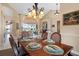 Open concept dining room area with table set, and views to the lanai at 2611 Little Country Rd, Parrish, FL 34219